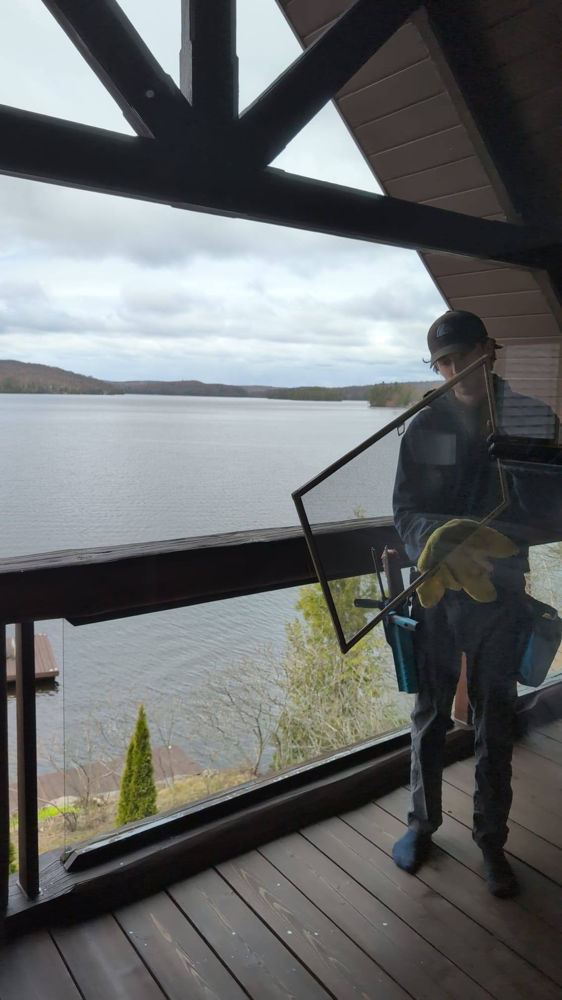 Cottage window cleaned above the lake