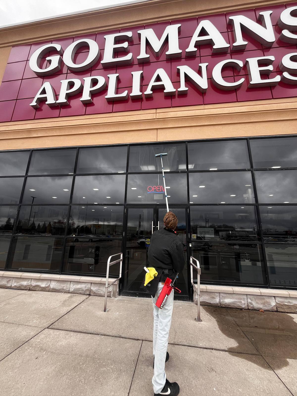 Storefront glass being cleaned at Goemans Appliances