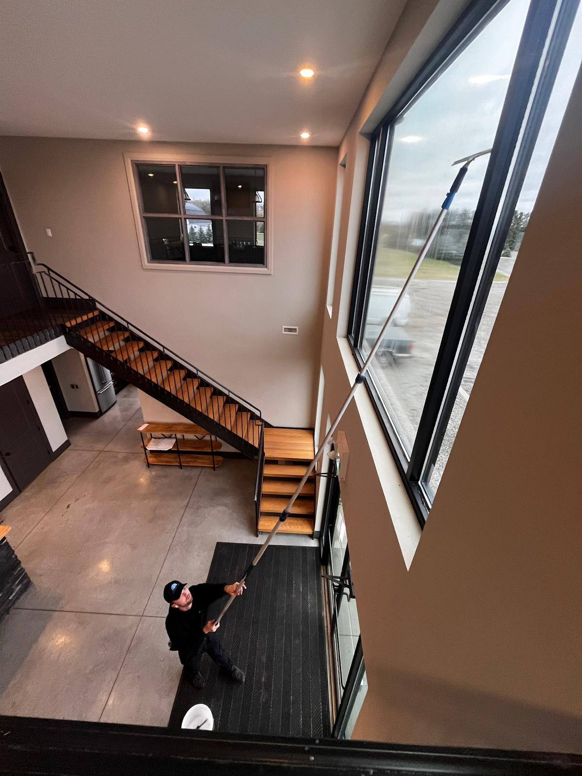 Two-storey interior window cleaned from inside
