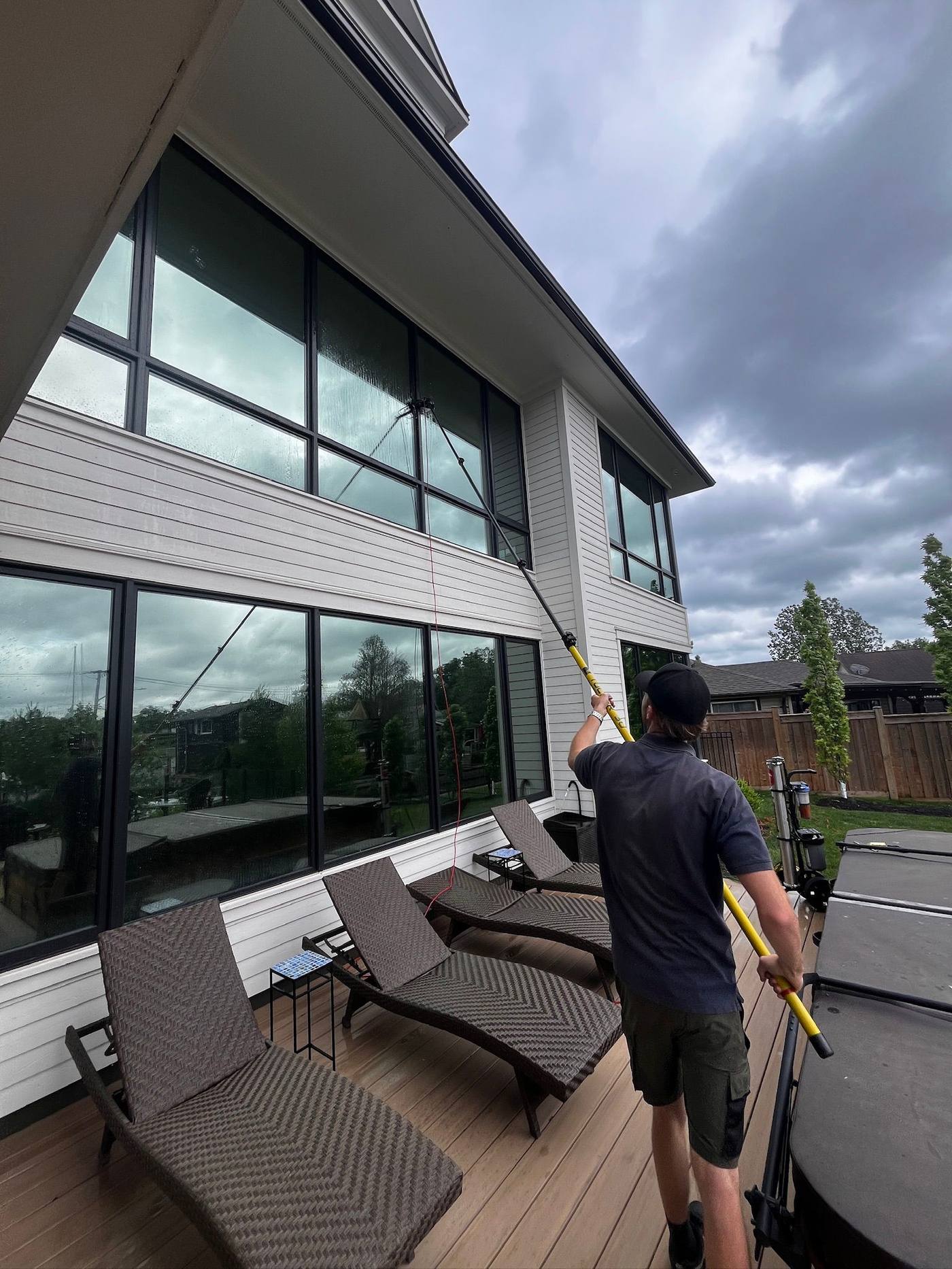 Cleaning the glass wall onto a back patio