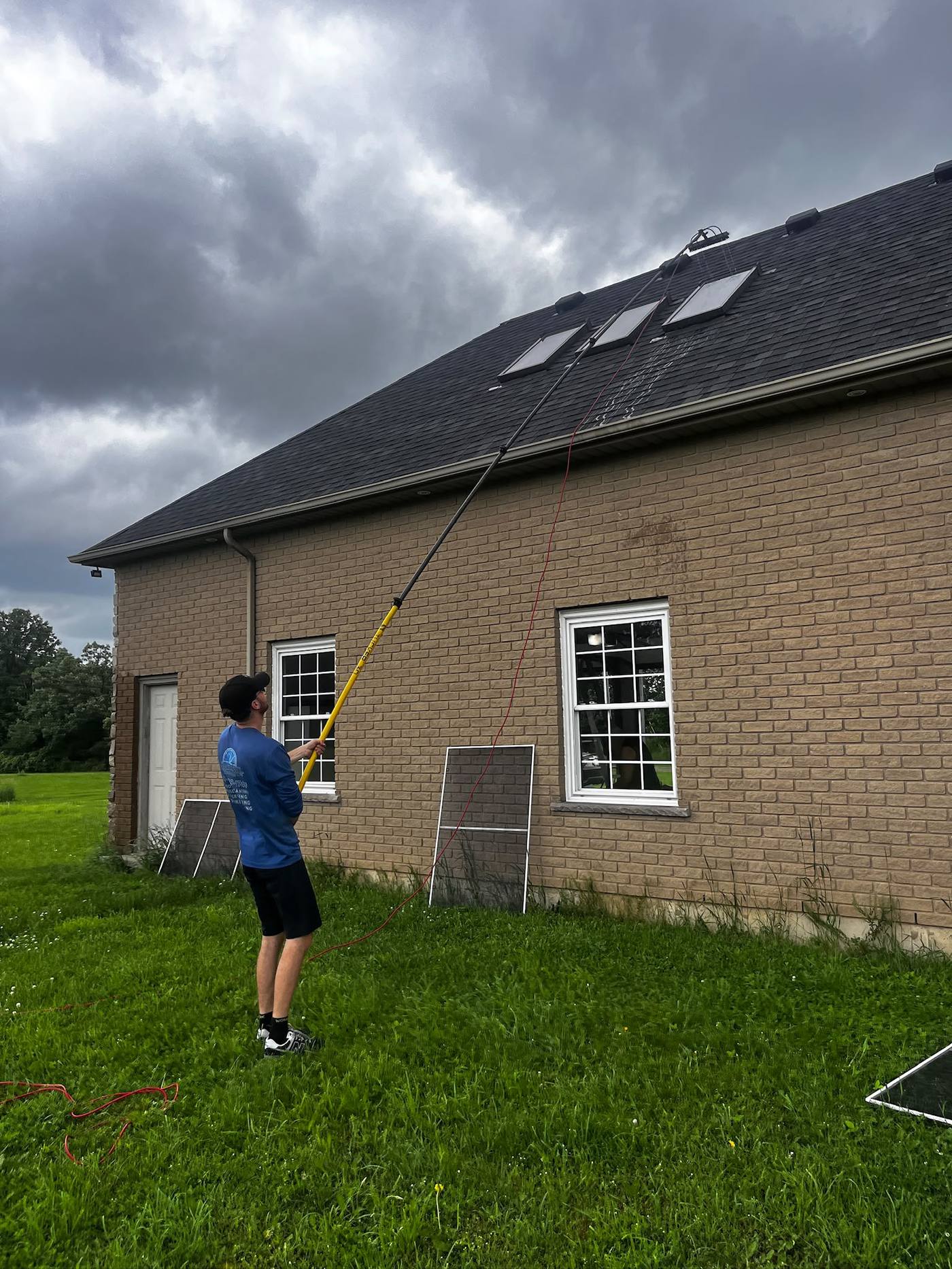 Reaching the roofline and skylights with an extension pole