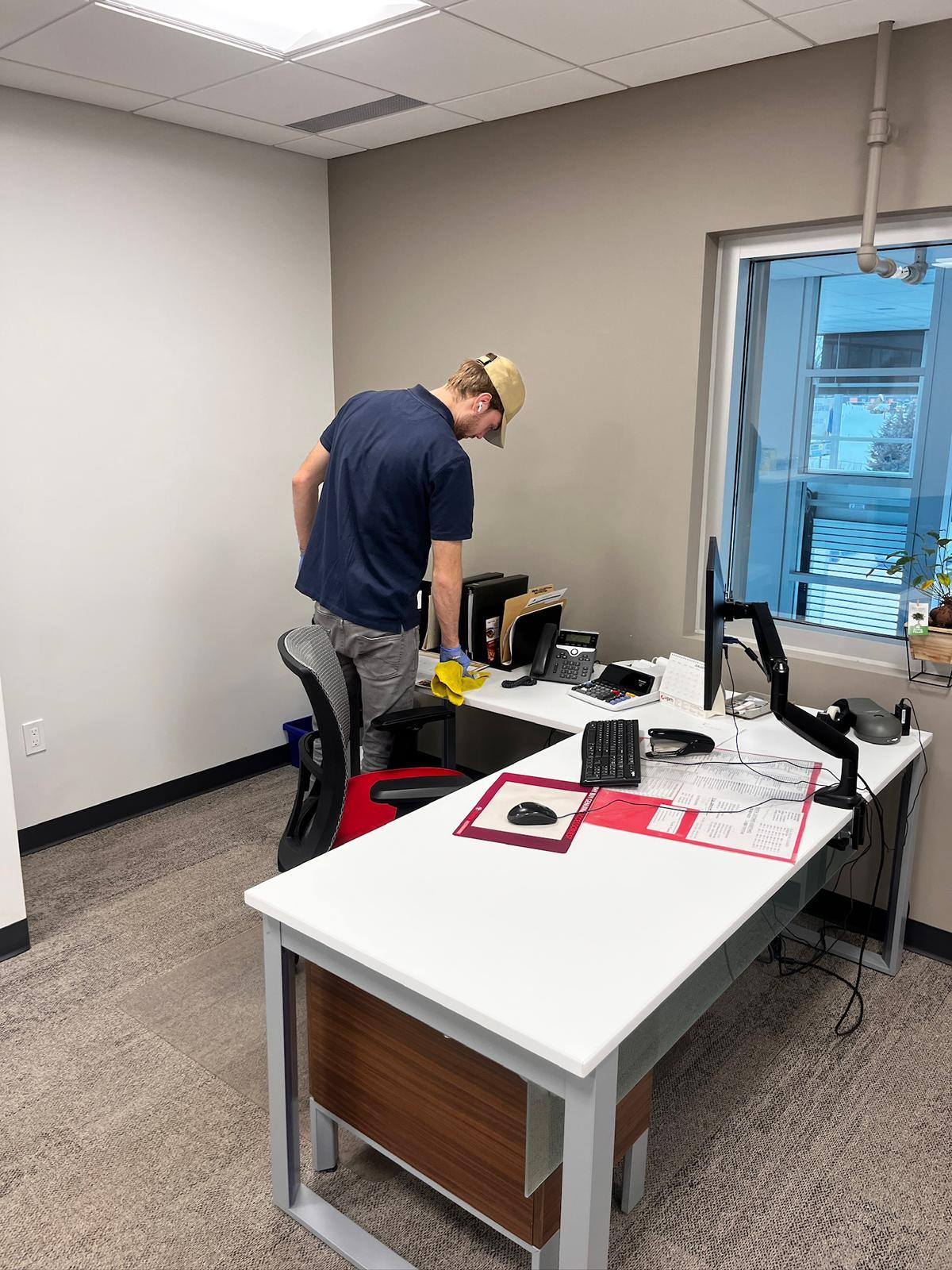 Wiping down desks and surfaces in an office