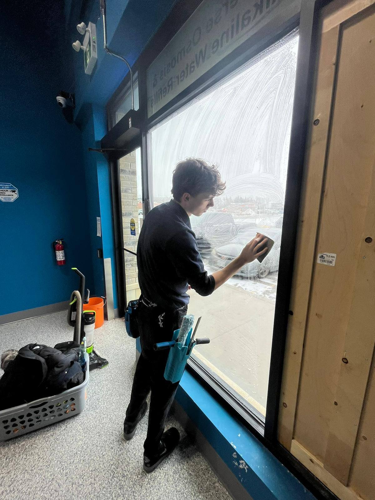 Large interior window cleaned by hand