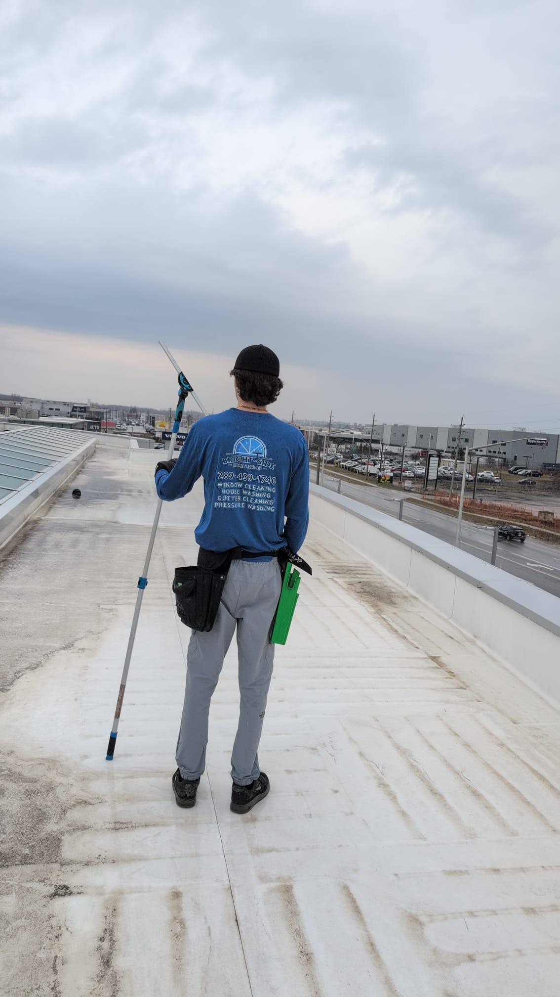 Crossing a flat commercial roof to reach the glass